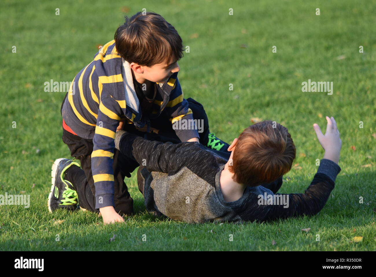 Pre teen young boys fighting Stock Photo