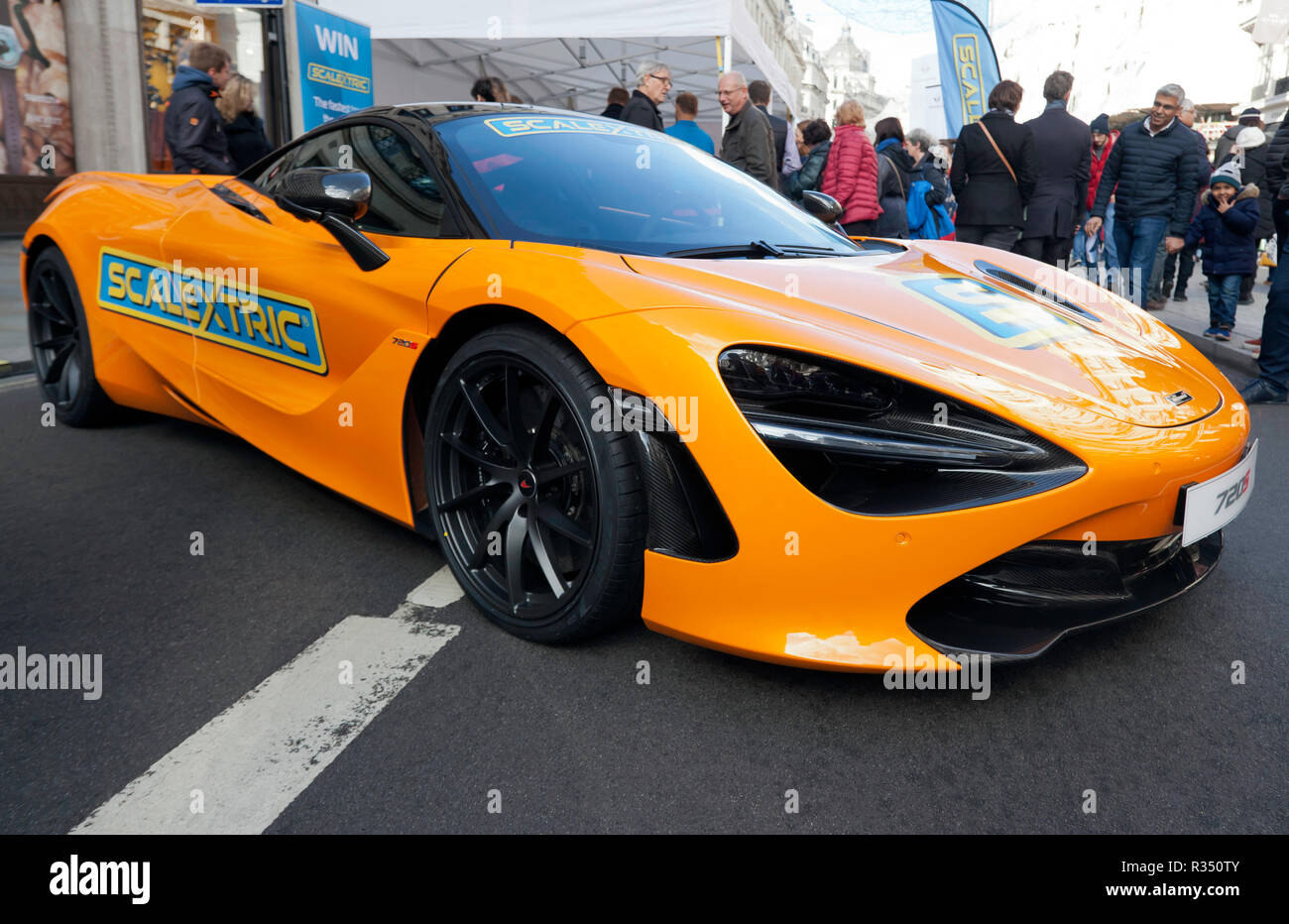Three-quarters front view of a yellow McLaren 720S, at the Scalextric stand, at the 2018 Regents Street Motor Show. Stock Photo