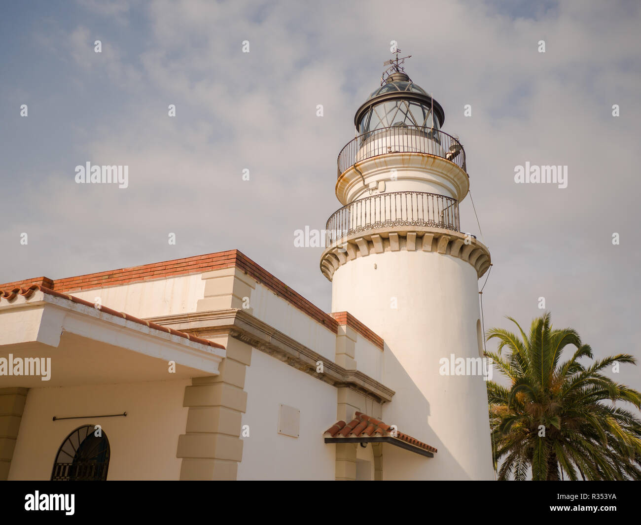 Calella Lighthouse is active lighthouse situated in coastal town of Calella in Costa del Maresme, Catalonia, Spain Stock Photo