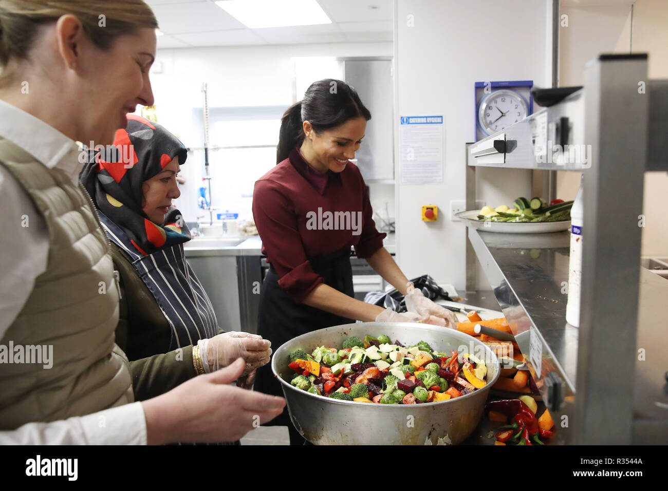 The Duchess Of Sussex Helps Prepare Food During Her To Visit The