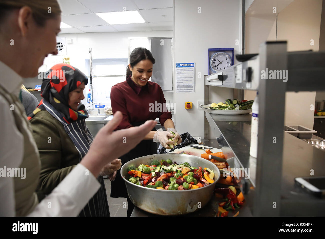 The Duchess Of Sussex Helps Prepare Food During Her To Visit The