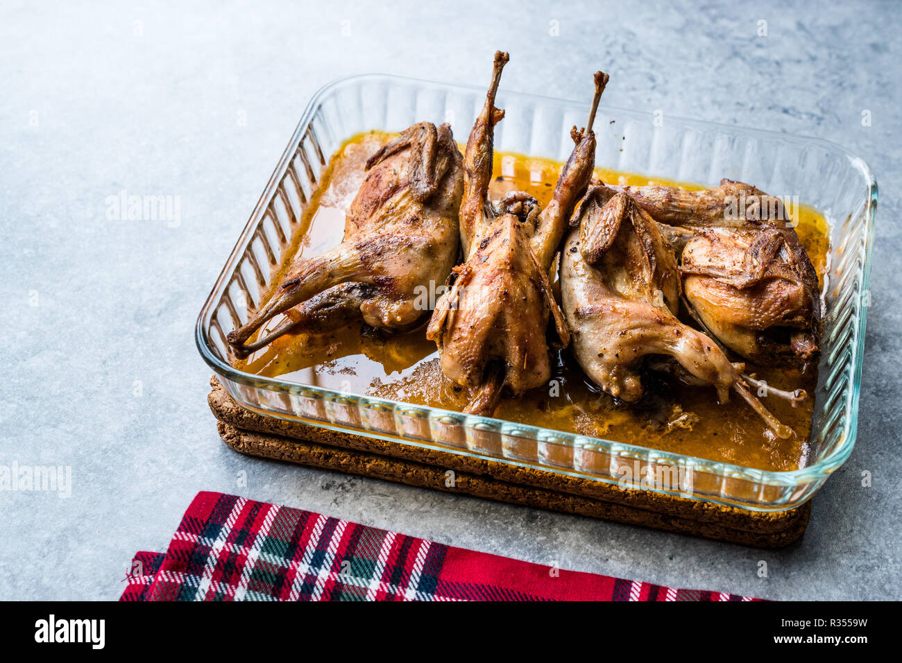 Roasted Crispy Quail Meat in Glass Bowl / Fried Small Chickens. Organic