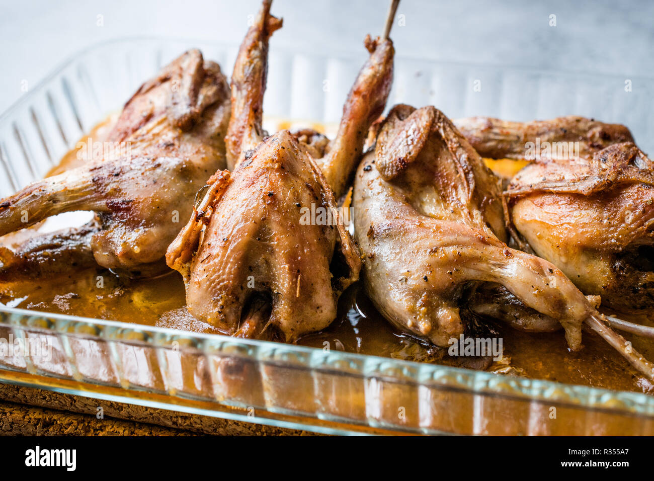 Roasted Crispy Quail Meat in Glass Bowl / Fried Small Chickens. Organic Food. Stock Photo