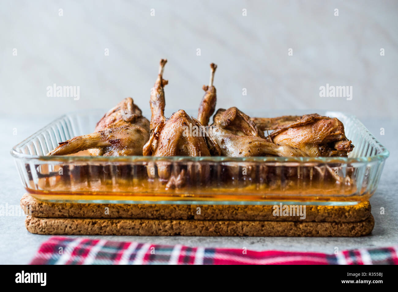 Roasted Crispy Quail Meat in Glass Bowl / Fried Small Chickens. Organic