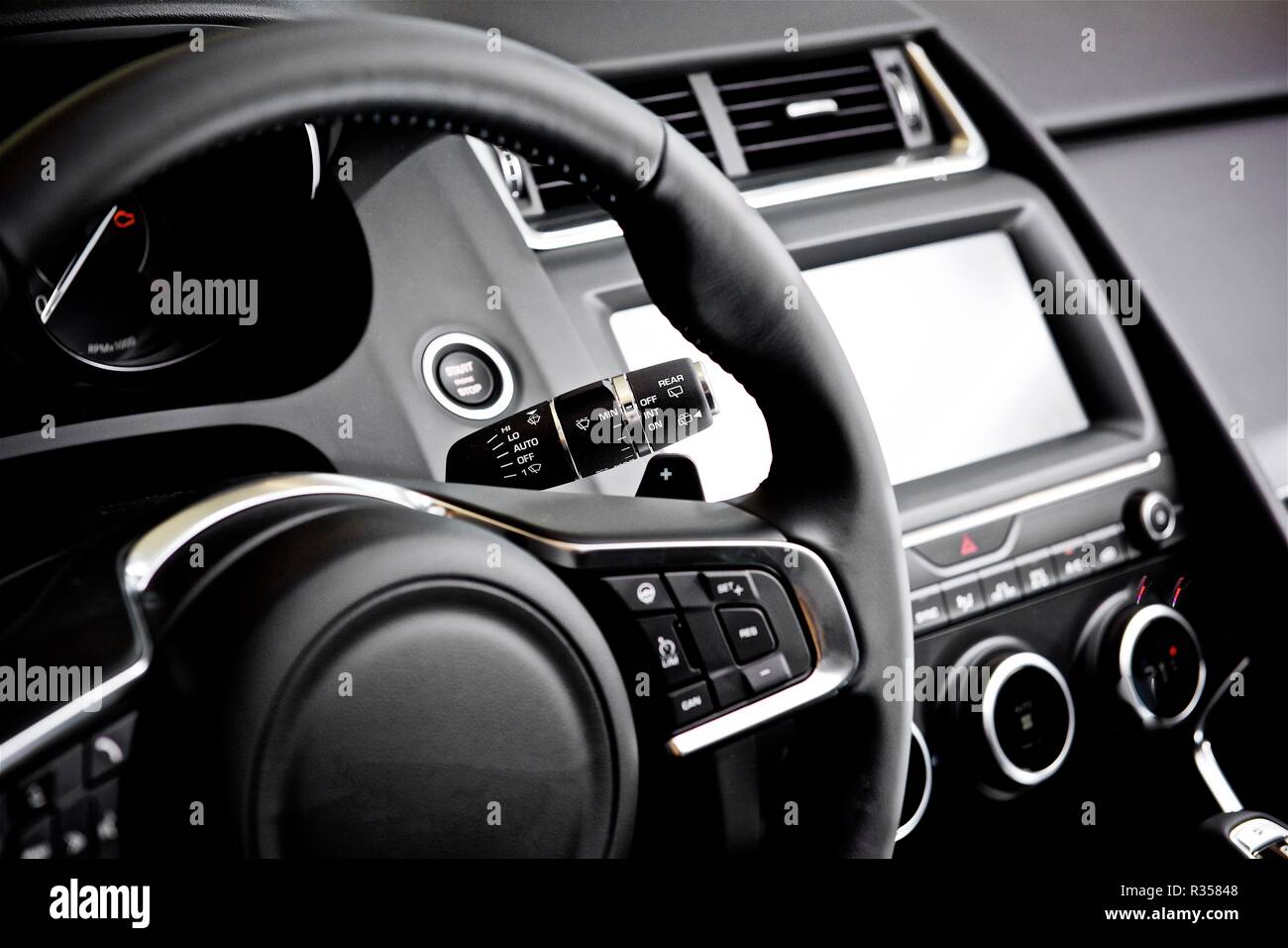 jaguar steering wheel Stock Photo - Alamy