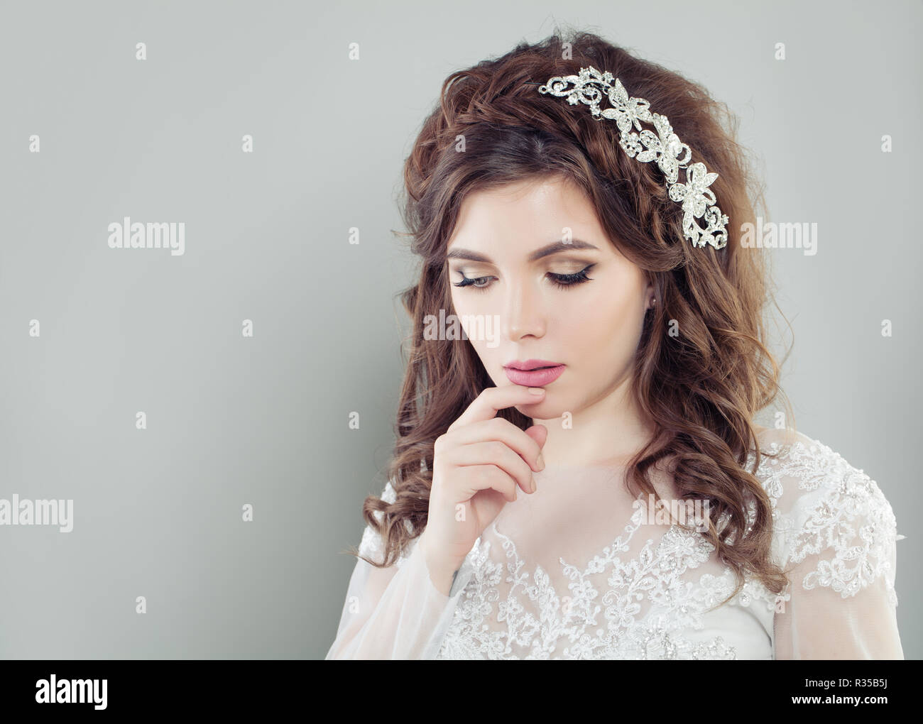Romantic Young Woman Bride With Makeup And Wavy Bridal Hairstyle