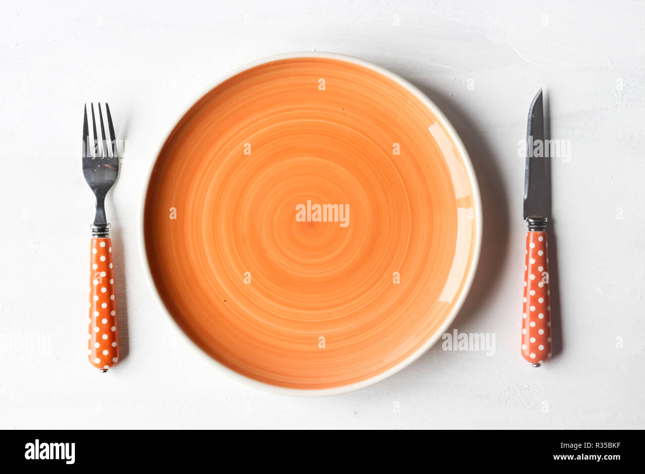 empty clean plate, fork and kinife Stock Photo