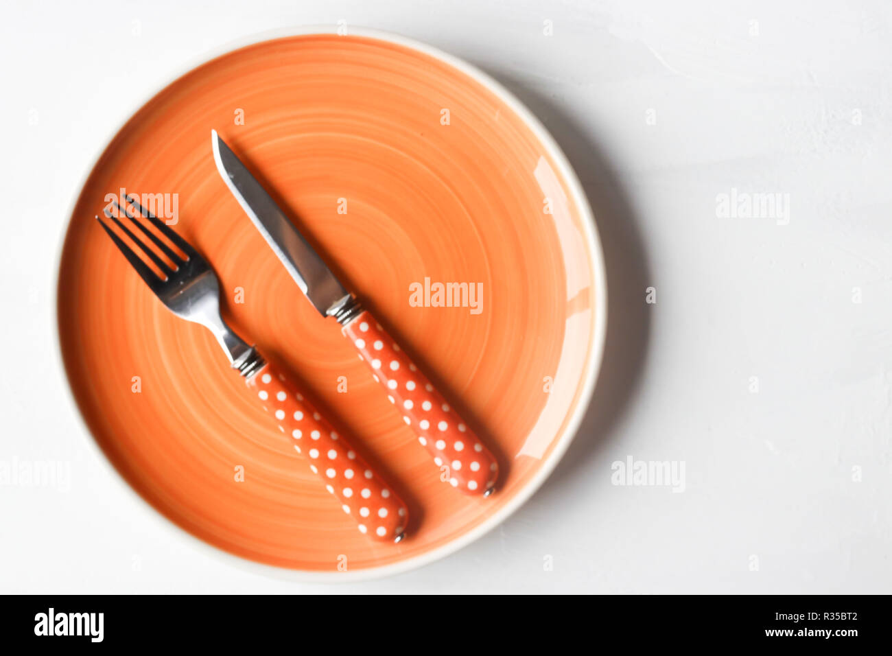 empty clean plate, fork and kinife Stock Photo