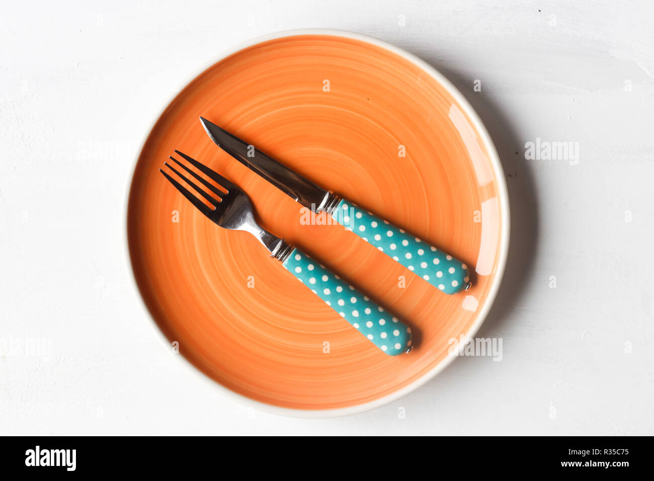 empty clean plate, fork and kinife Stock Photo