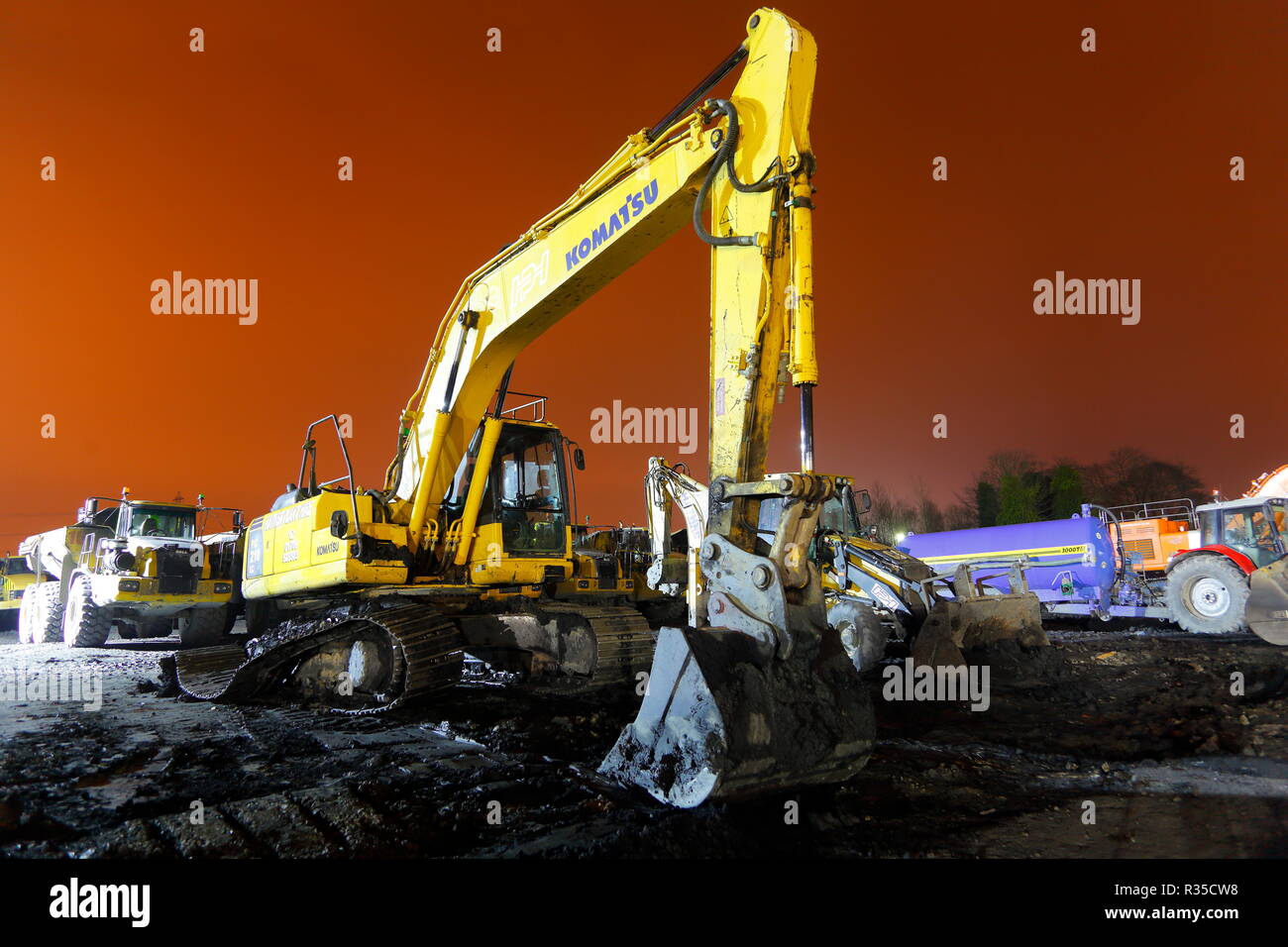 A Komatsu backhoe with a broken track sits idle on the old Recycoal Coal Recycling Plant in Rossington,Doncaster which has now been demolished. Stock Photo