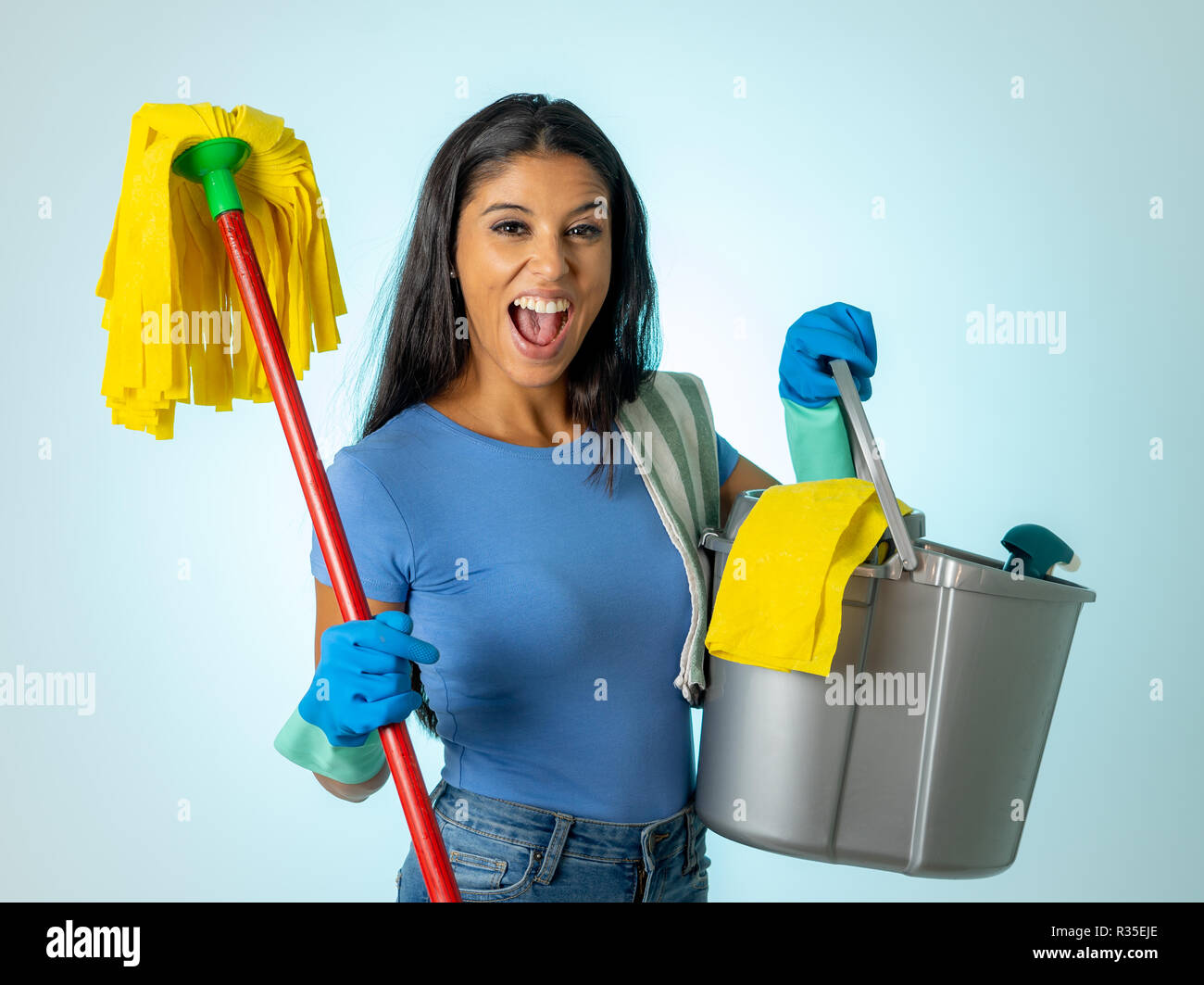 Free Photo  Cleaning concept. young woman holding cleaning tools