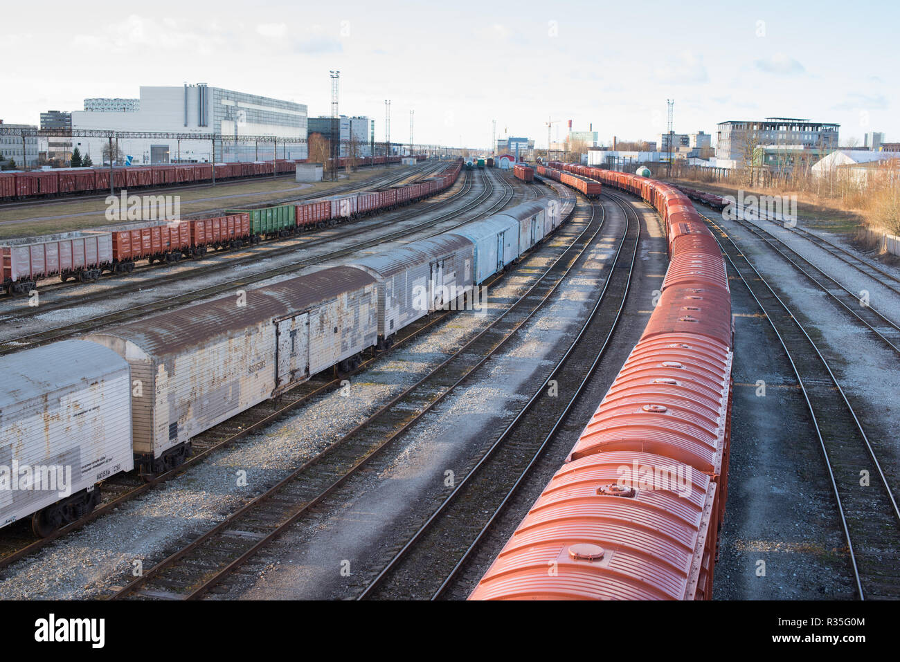 Tallinn, Estonia - December 27, 2015: Railway Station of Tallinn, Ülemiste. Sixteen rails wide transportation hub with long cargo trains. Stock Photo