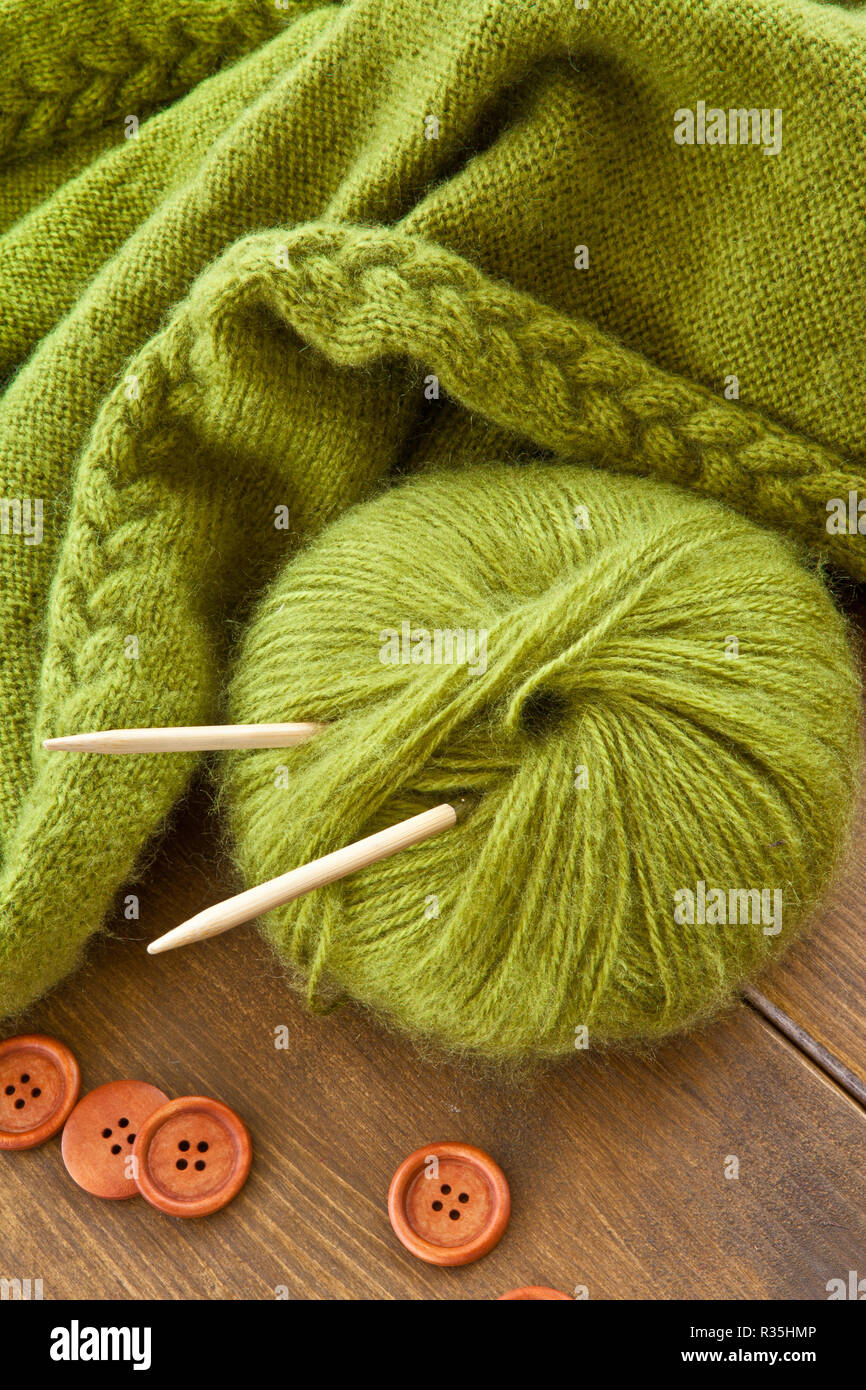 even knitted scarf made of green wool Stock Photo