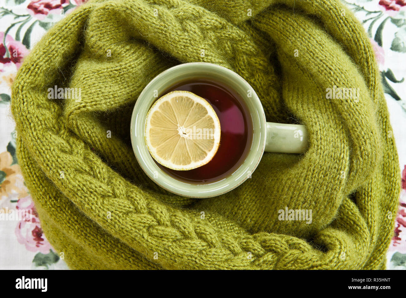 cup of tea with warm scarf Stock Photo