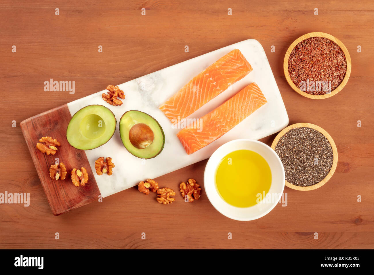 Healthy omega3 diet food. Raw salmon, avocado, walnuts, chia seeds