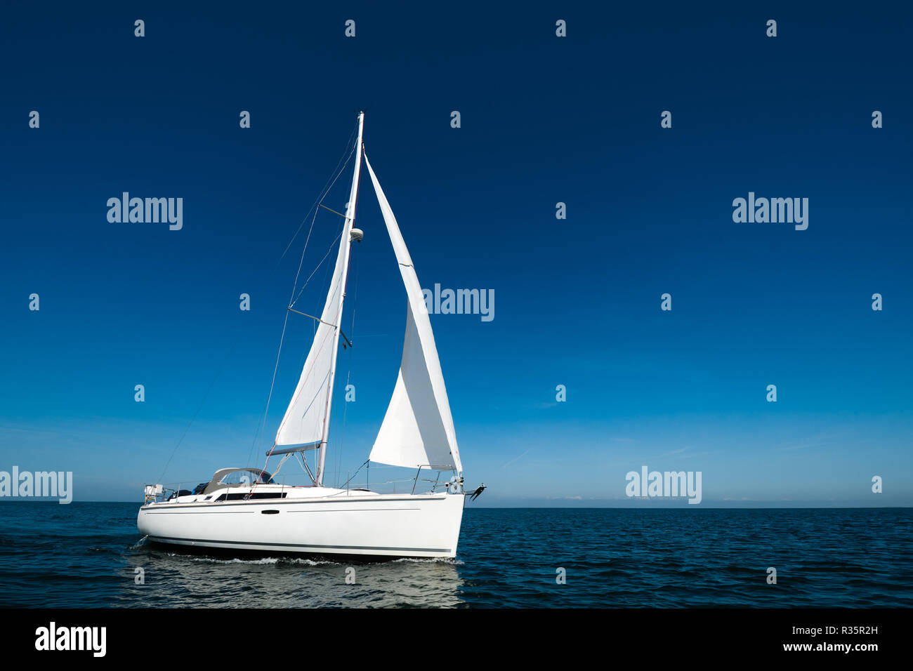 sailboat under blue sky Stock Photo