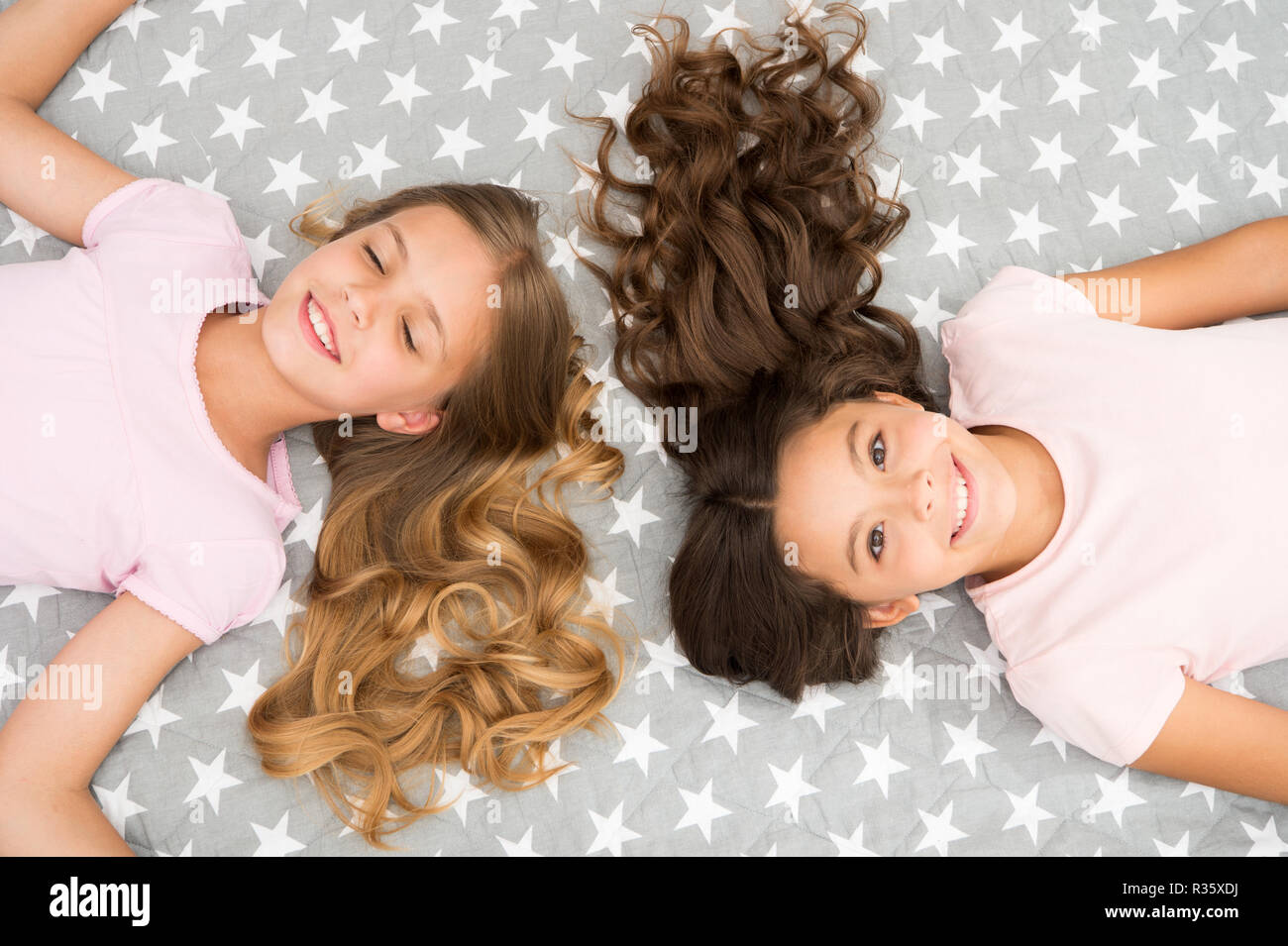 Girls With Long Curly Hair Lay On Bed Top View Children Perfect