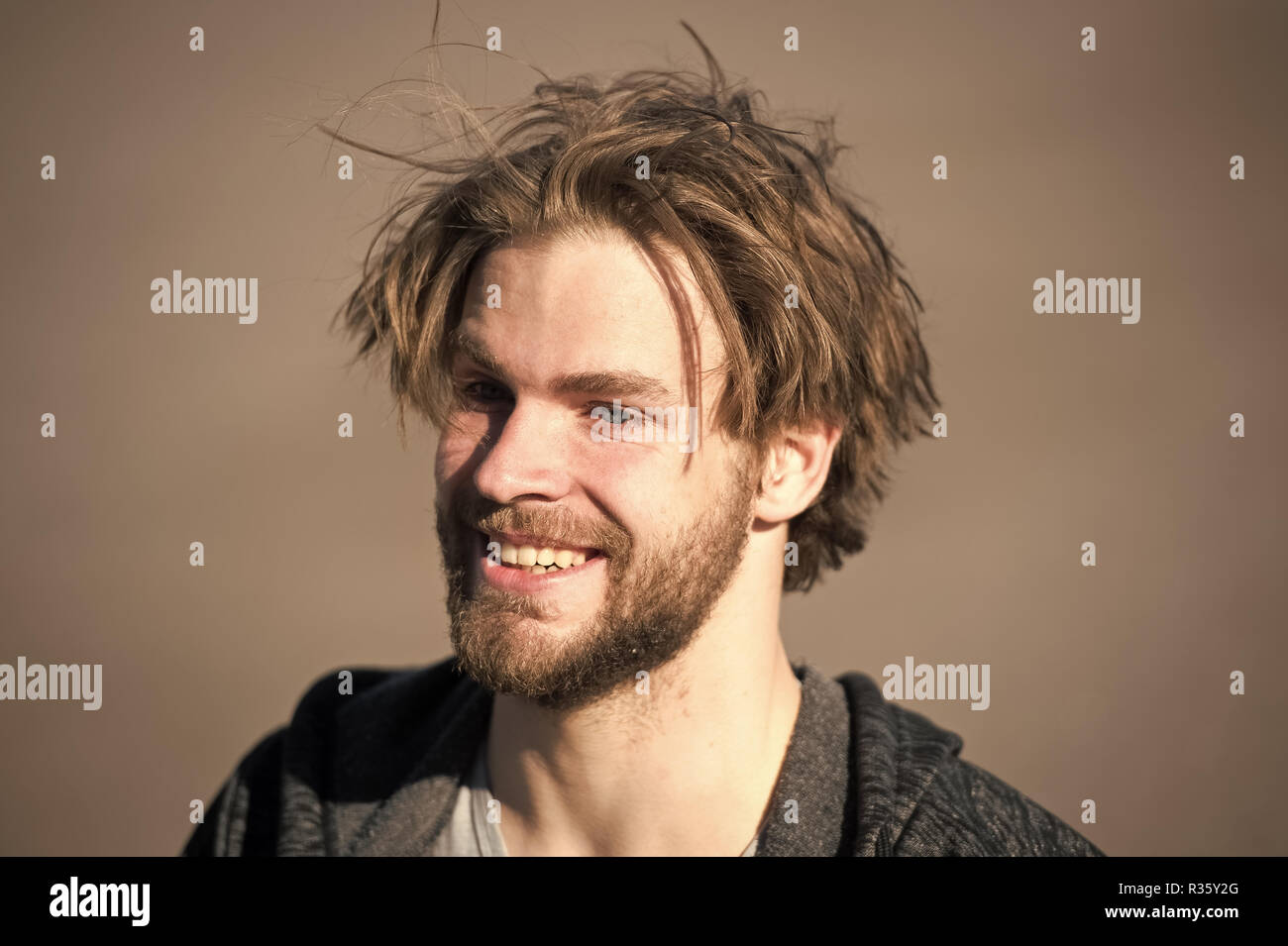 happy handsome man with smiling face or bearded guy with beard and