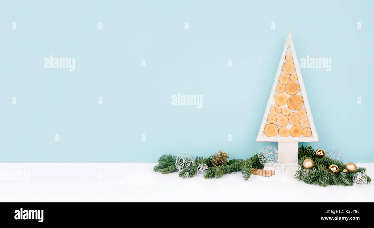 Christmas wooden tree over dark light blue background Stock Photo - Alamy