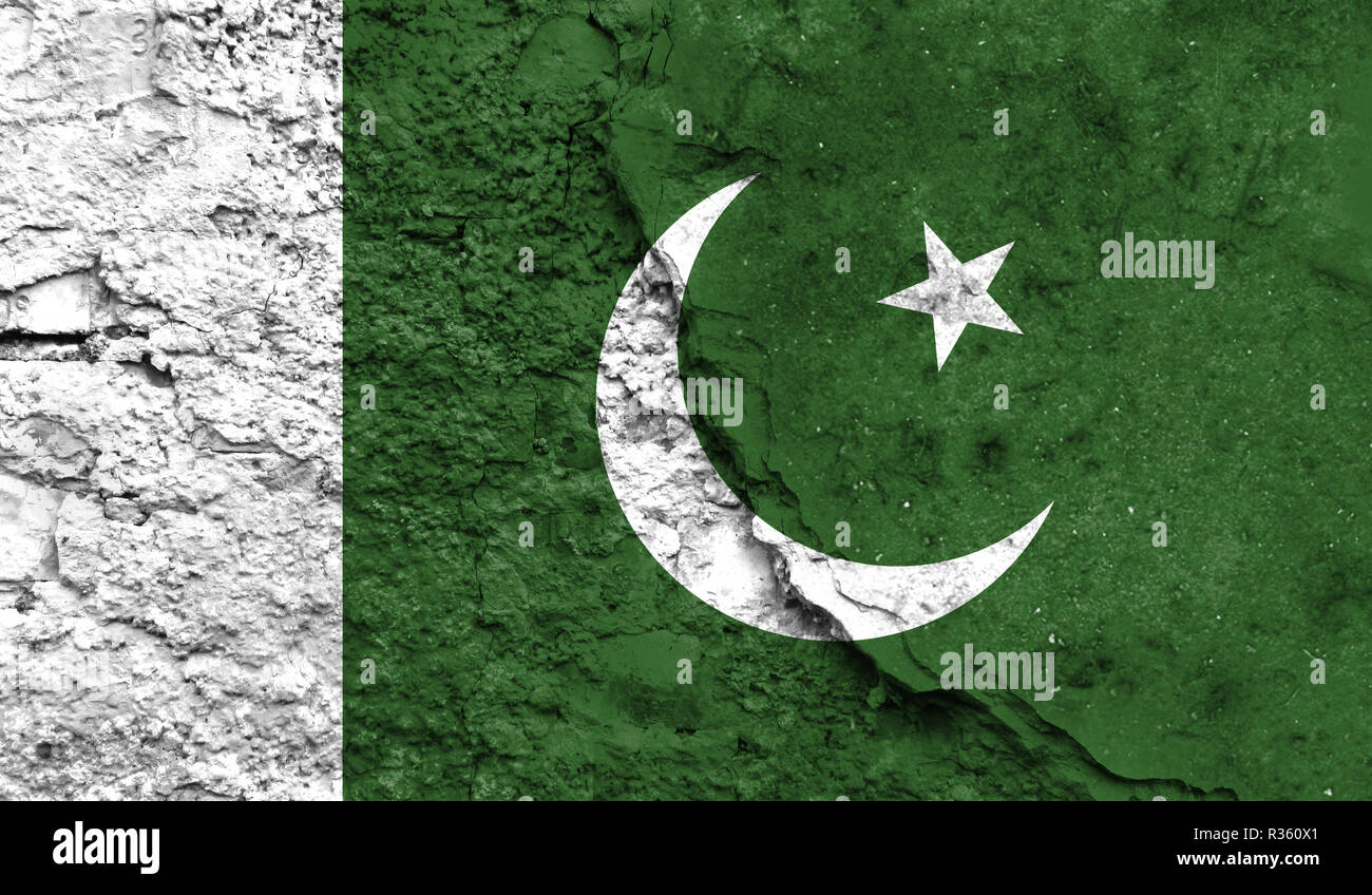 Flag of Pakistan close up painted on a cracked wall, concept of armed ...