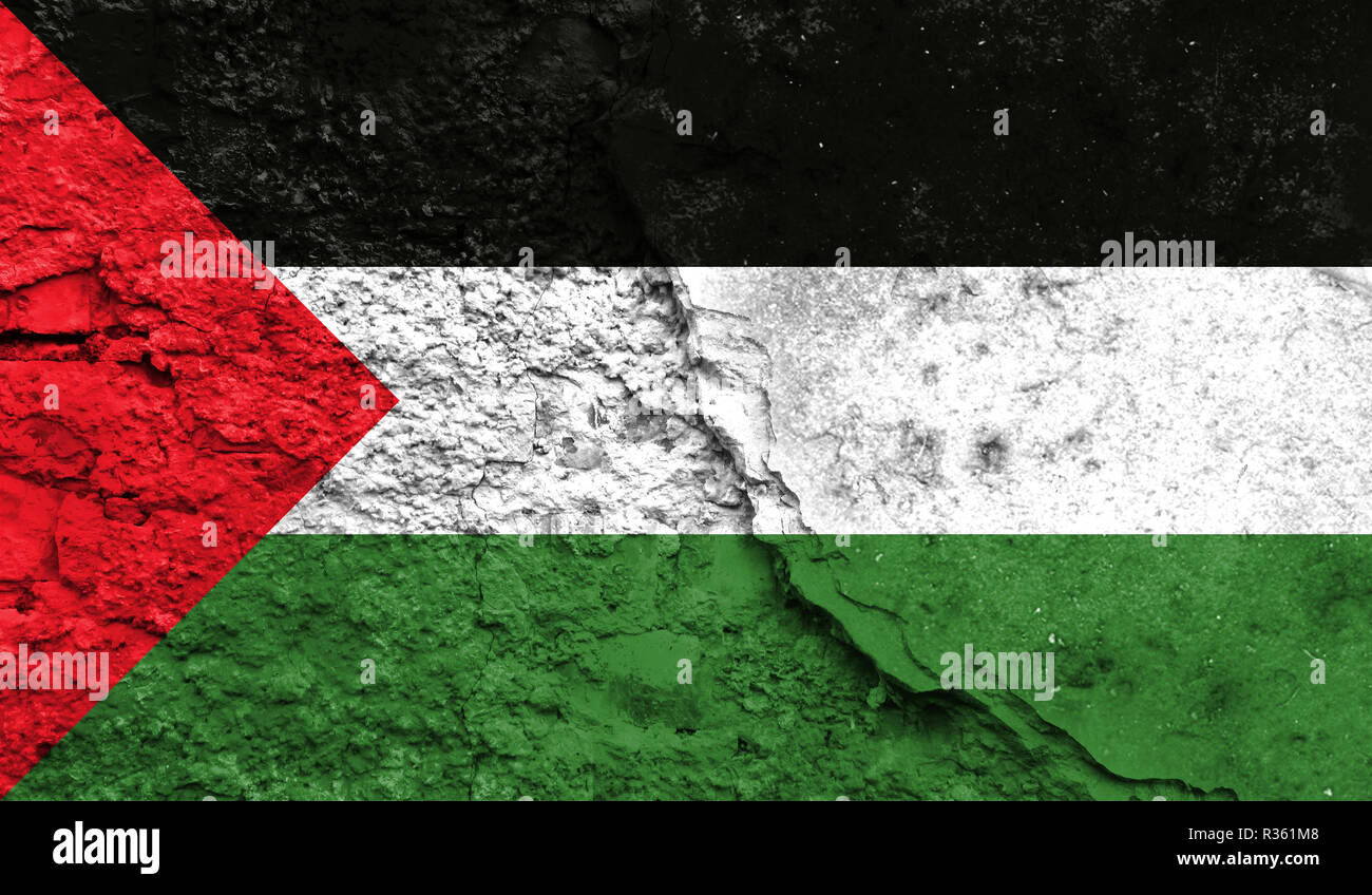 Flag of Palestine close up painted on a cracked wall, concept of armed actions and conflicts in the world Stock Photo