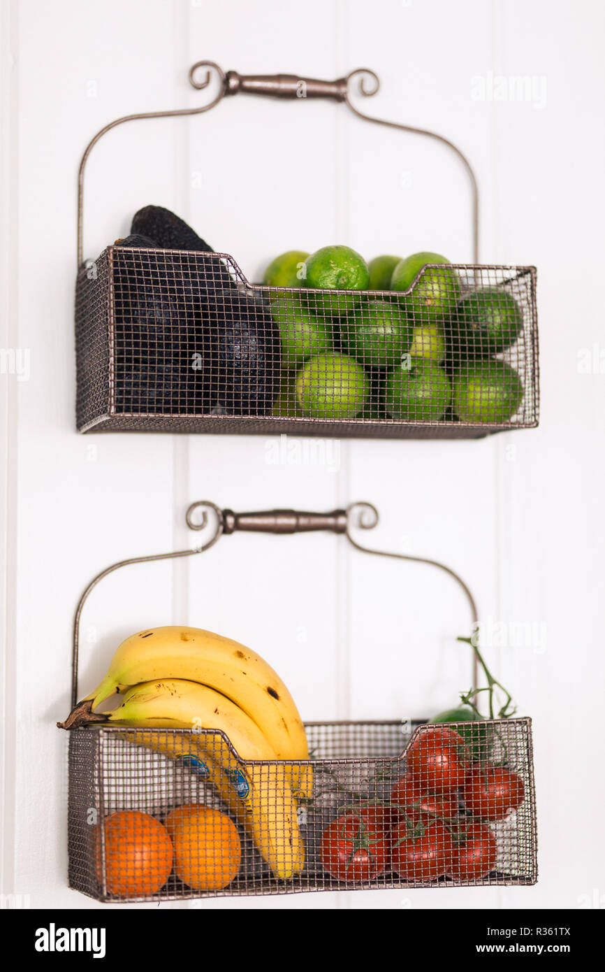 Two hanging baskets of fresh fruits Stock Photo