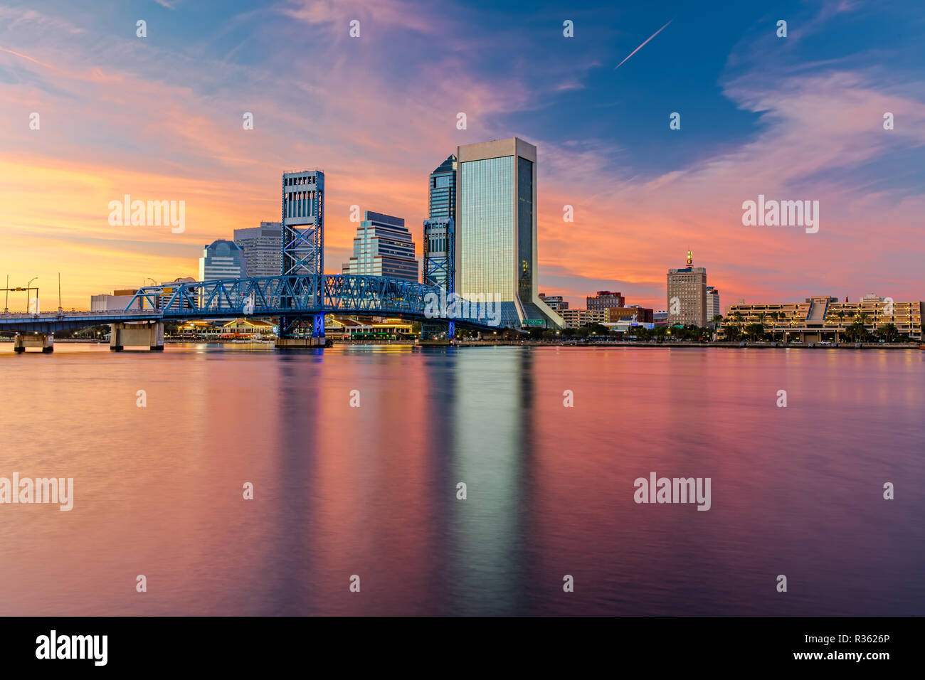 Skyline of Jacksonville, FL and Main Street Bridge at Dusk Stock Photo