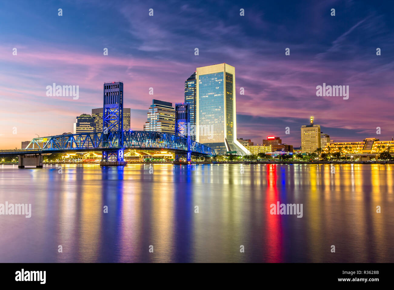 Skyline of Jacksonville, FL and Main Street Bridge at Dusk Stock Photo