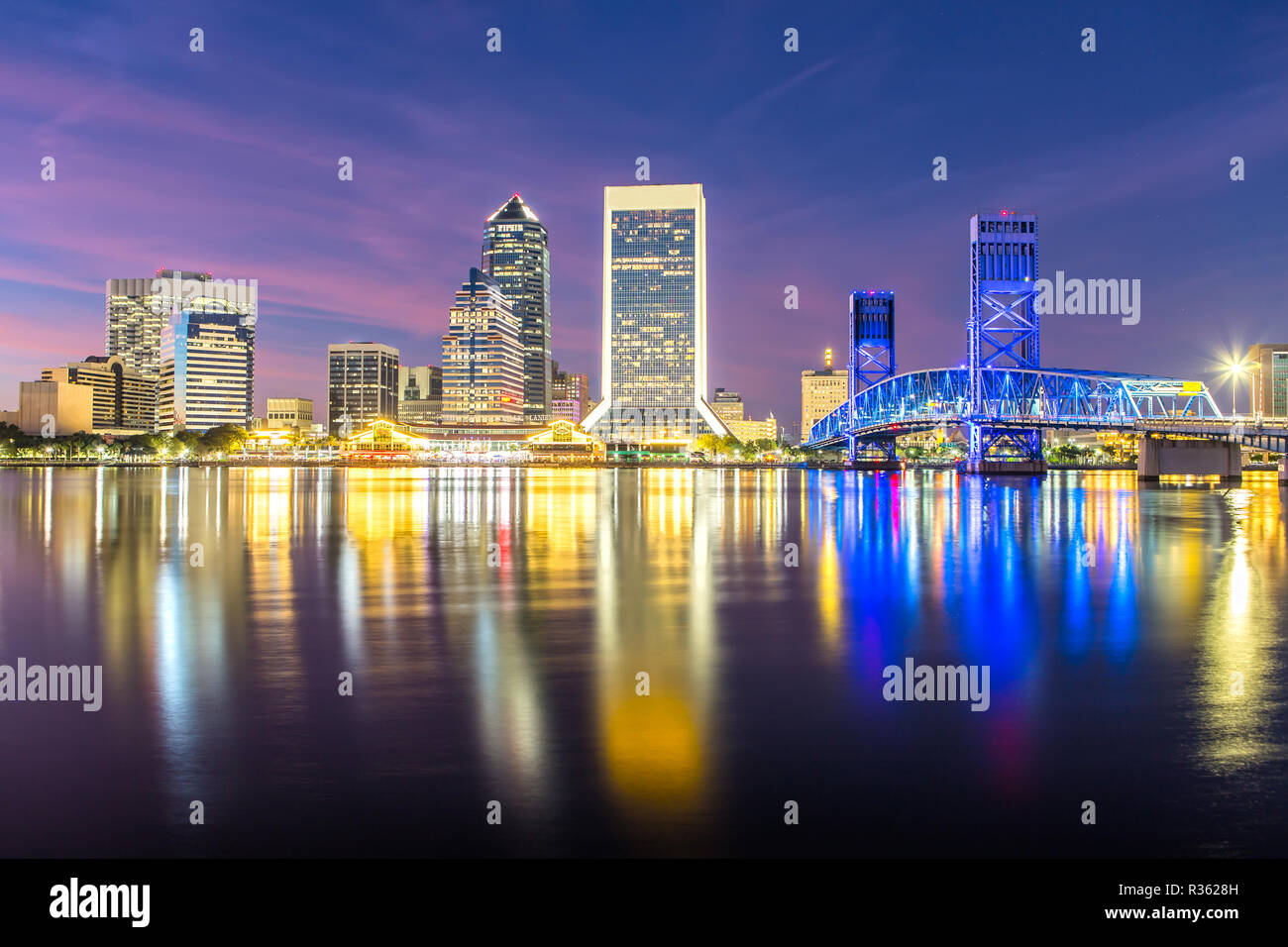 Skyline of Jacksonville, FL and Main Street Bridge at Dusk Stock Photo