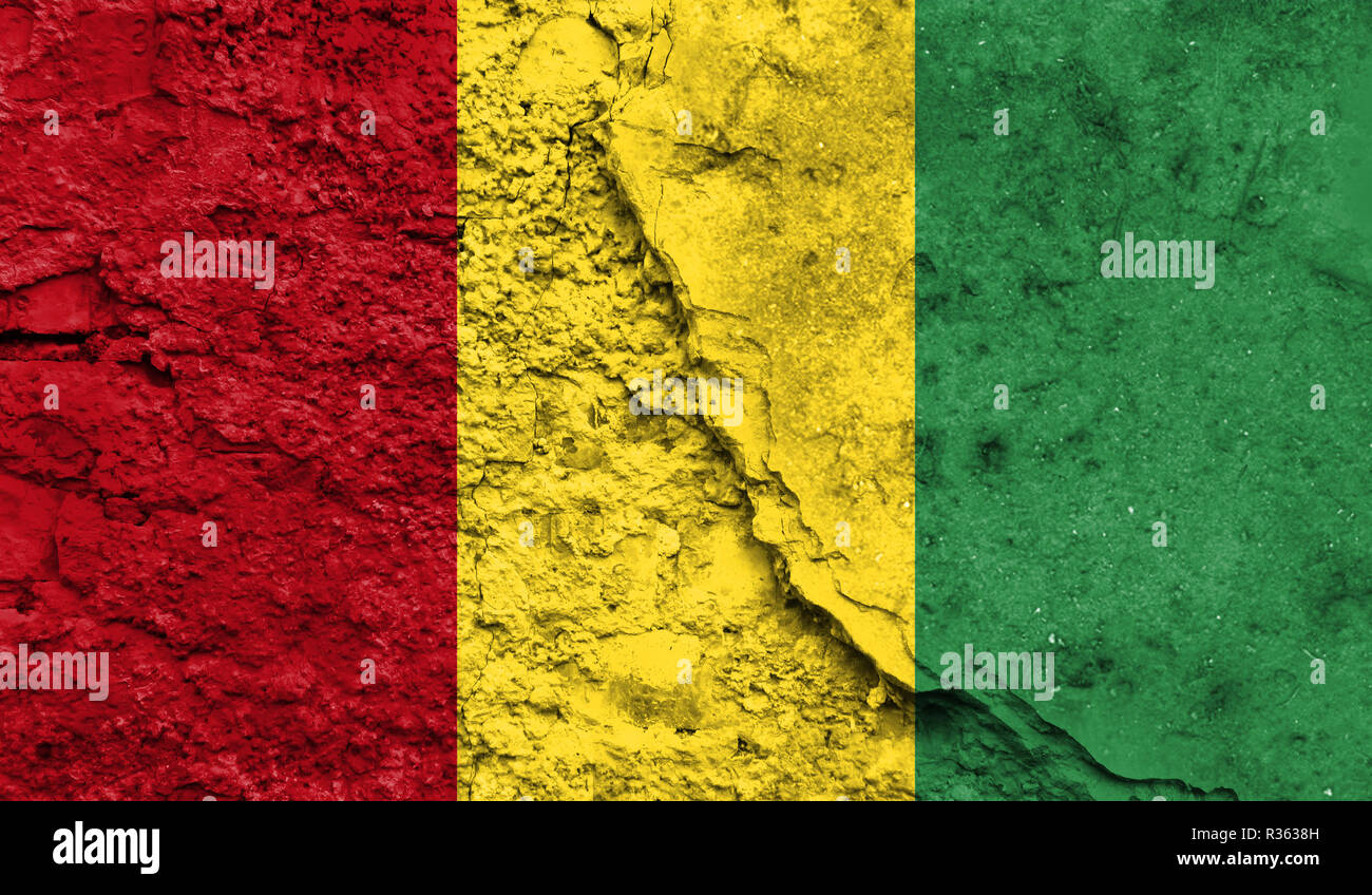 Flag of Guinea close up painted on a cracked wall, concept of armed ...