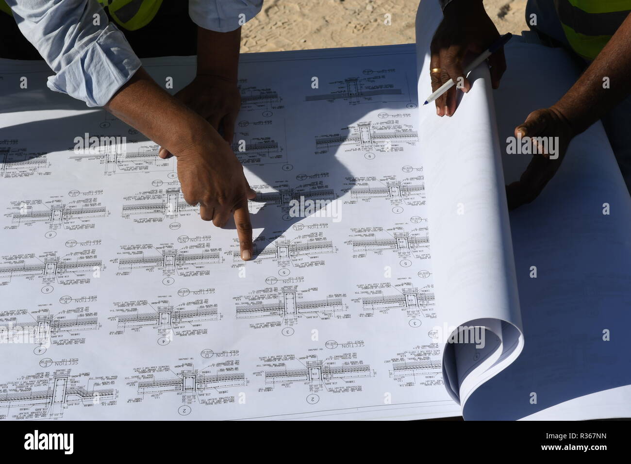 Skilled Engineers are doing daily Work Inspections to make sure the work has no problems Stock Photo
