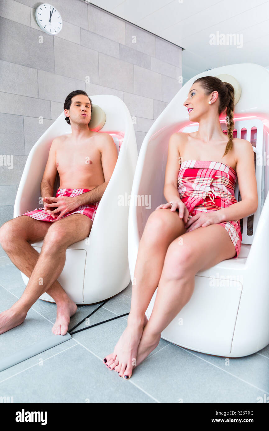 couple on infrared chairs at spa Stock Photo