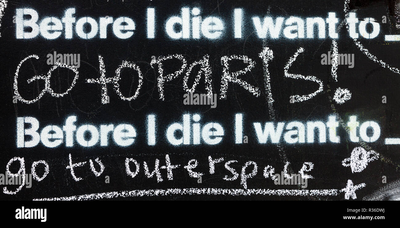 Fragment of a blackboard reading: Before I die I want to go to Paris Stock Photo