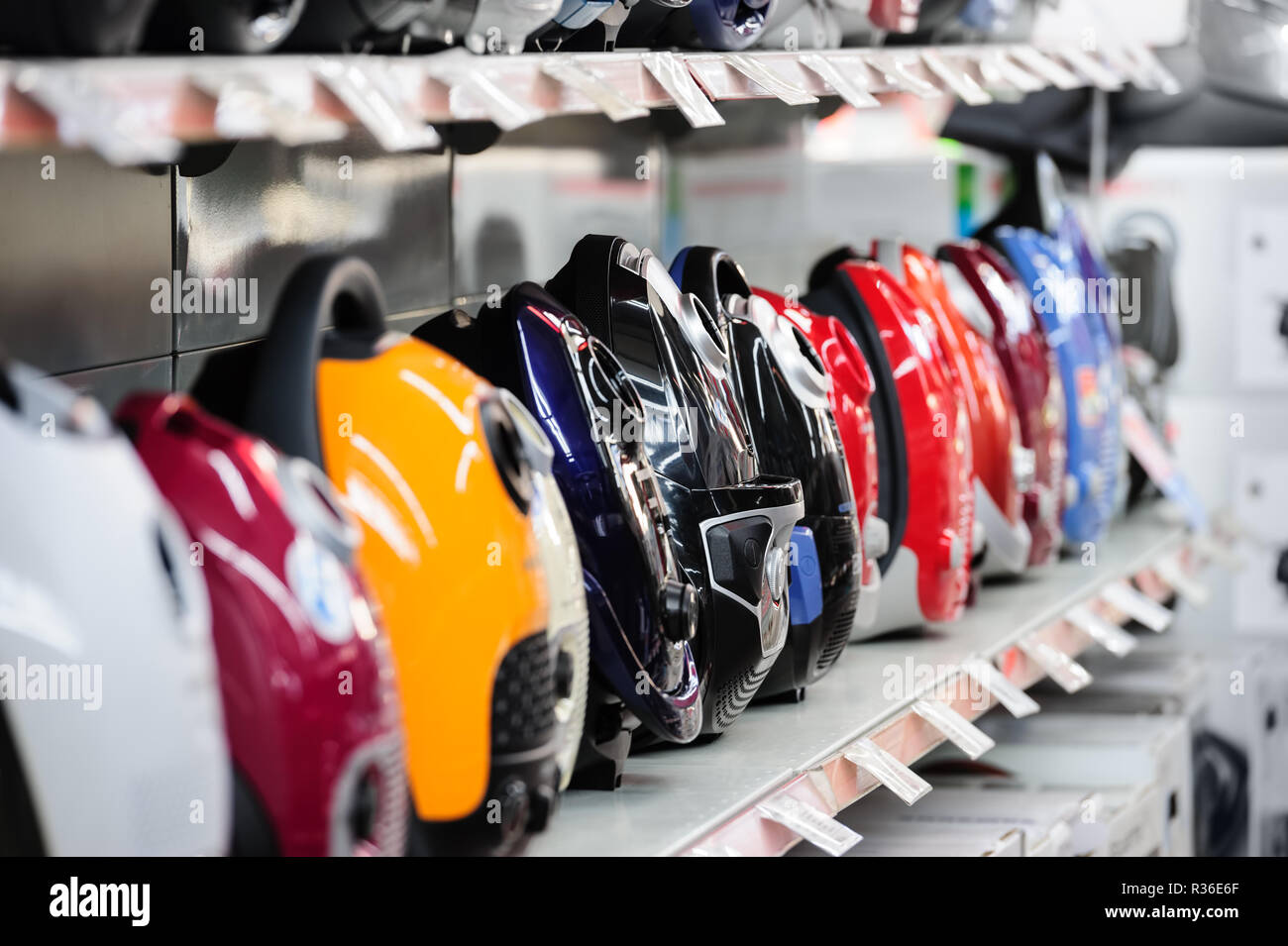 Row of vacuum cleaners in appliance store Stock Photo