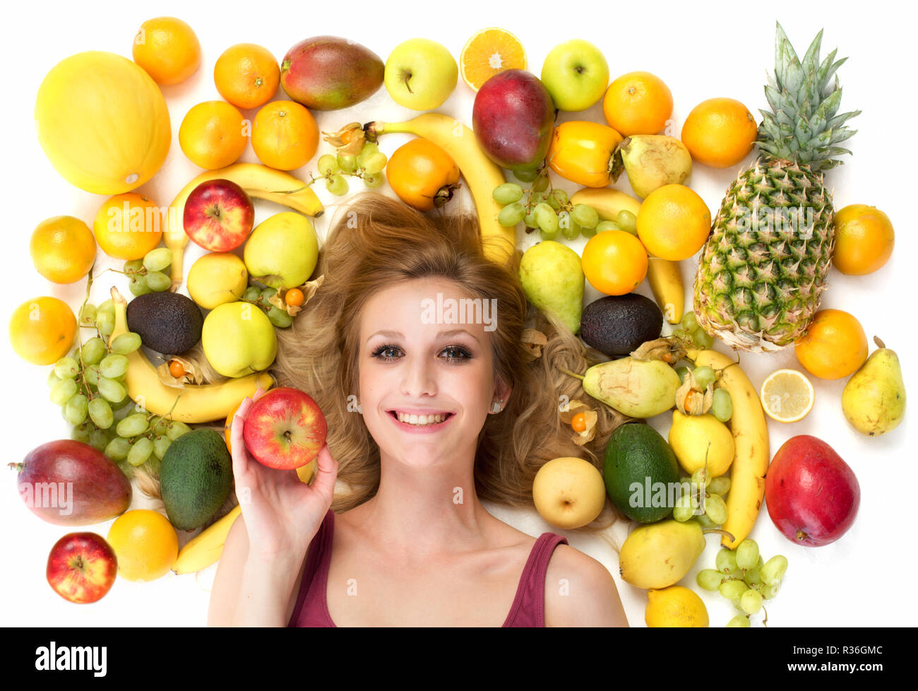 woman surrounded by fruit Stock Photo