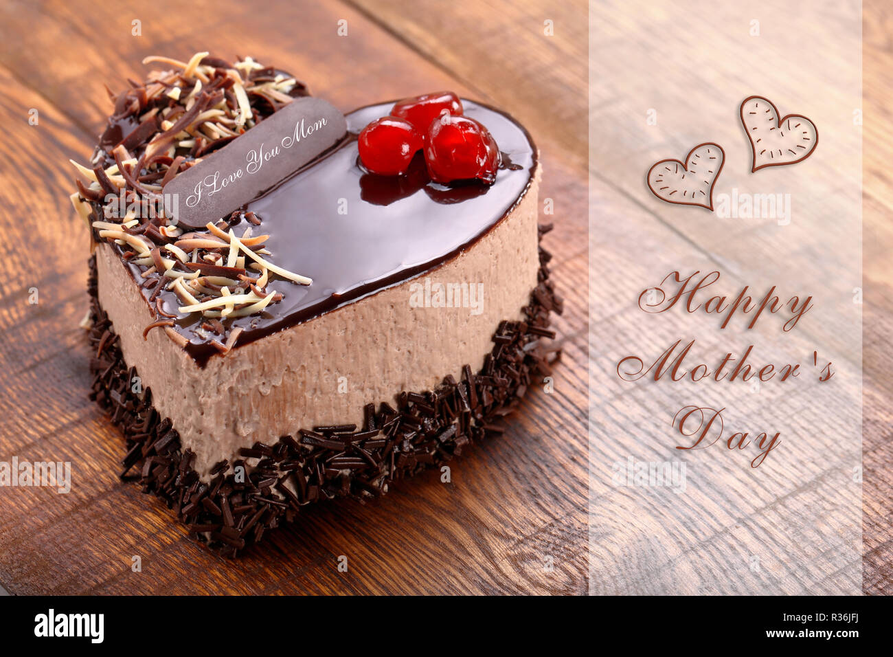 Mother's day chocolate cake in shape of heart with inscription I ...