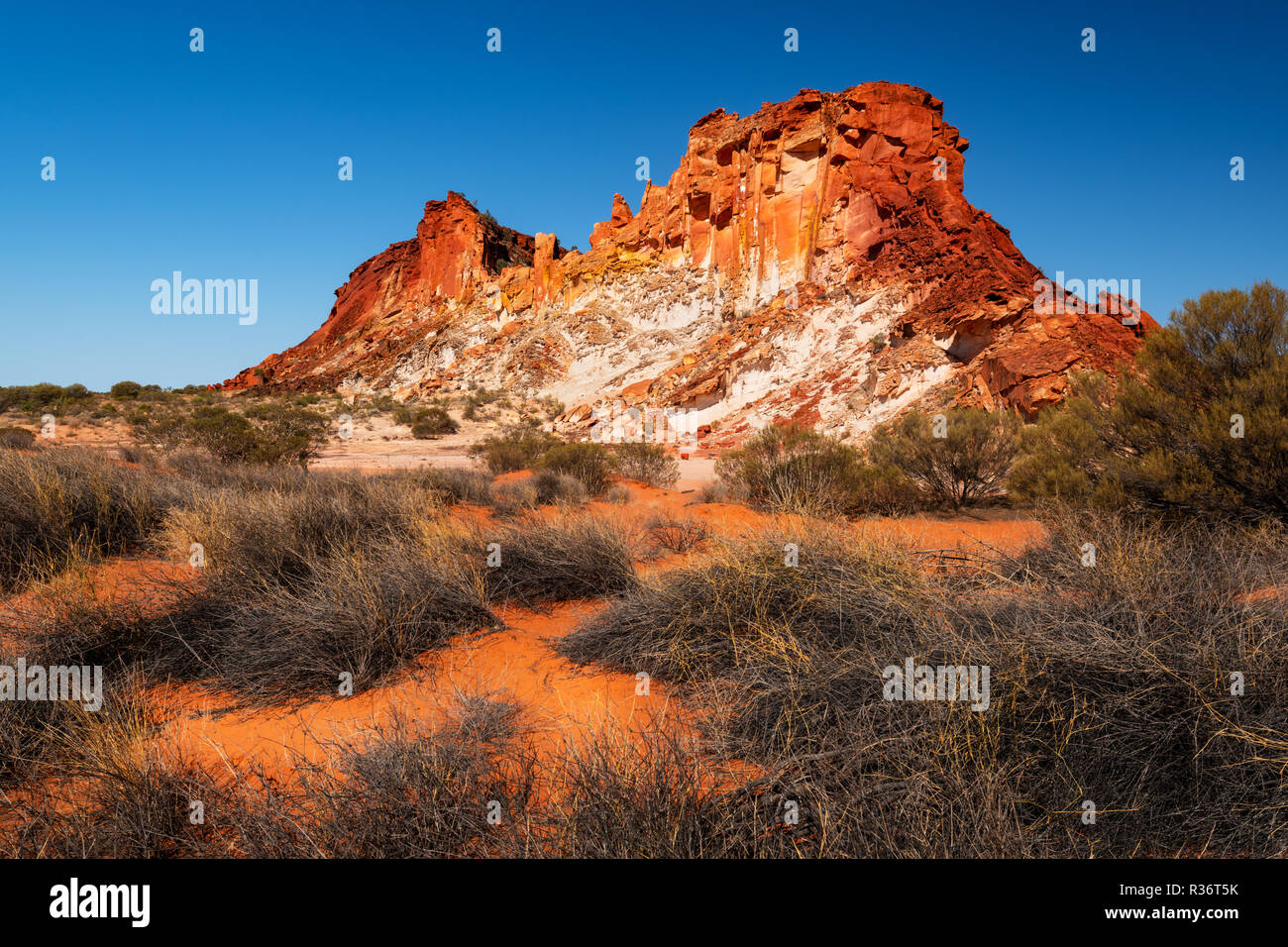 Rugged Rainbow Valley with its coloured rock. Stock Photo