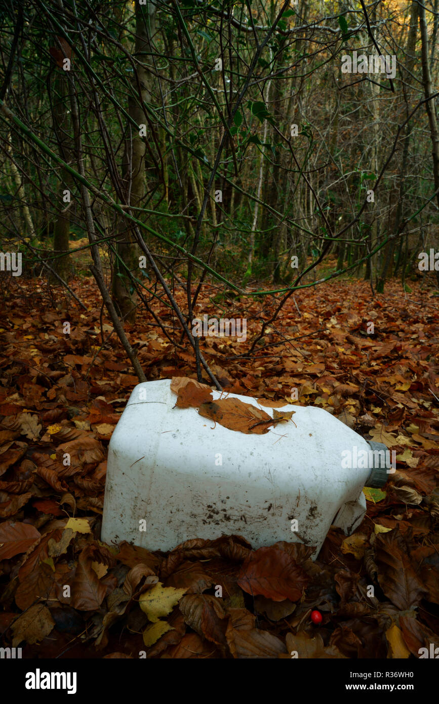 Ashdown Forest Sussex UK a plastic can discarded in a woodland enviroment Stock Photo