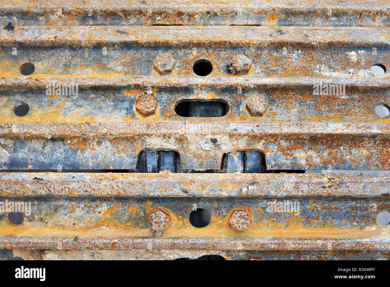 Rusty excavator caterpillar background concept Stock Photo