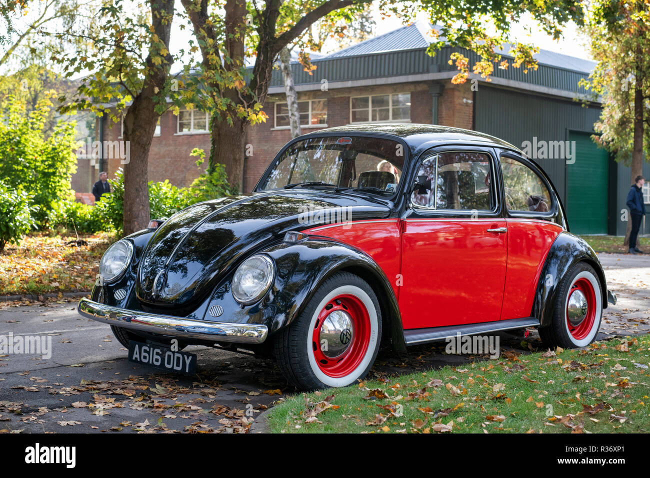 Red and black vintage VW Beetle car at Bicester heritage centre autumn sunday scramble event. Bicester, Oxfordshire, UK Stock Photo