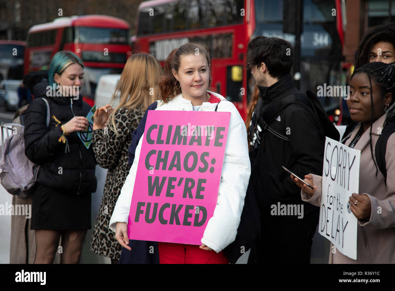 Climate change activists from the Extinction Rebellion group block roads in central London at Elephant and Castle in protest that the government is not doing enough to avoid catastrophic climate change and to demand the government take radical action to save the planet, on 21st November 2018 in London, England, United Kingdom. Extinction Rebellion is a climate change group started in 2018 and has gained a huge following of people committed to peaceful protests. Stock Photo