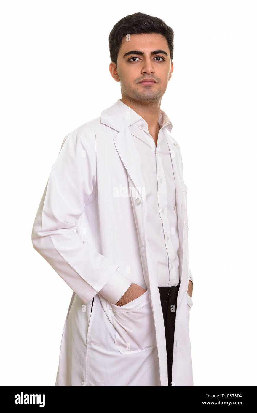 Young handsome Persian man doctor looking at camera Stock Photo