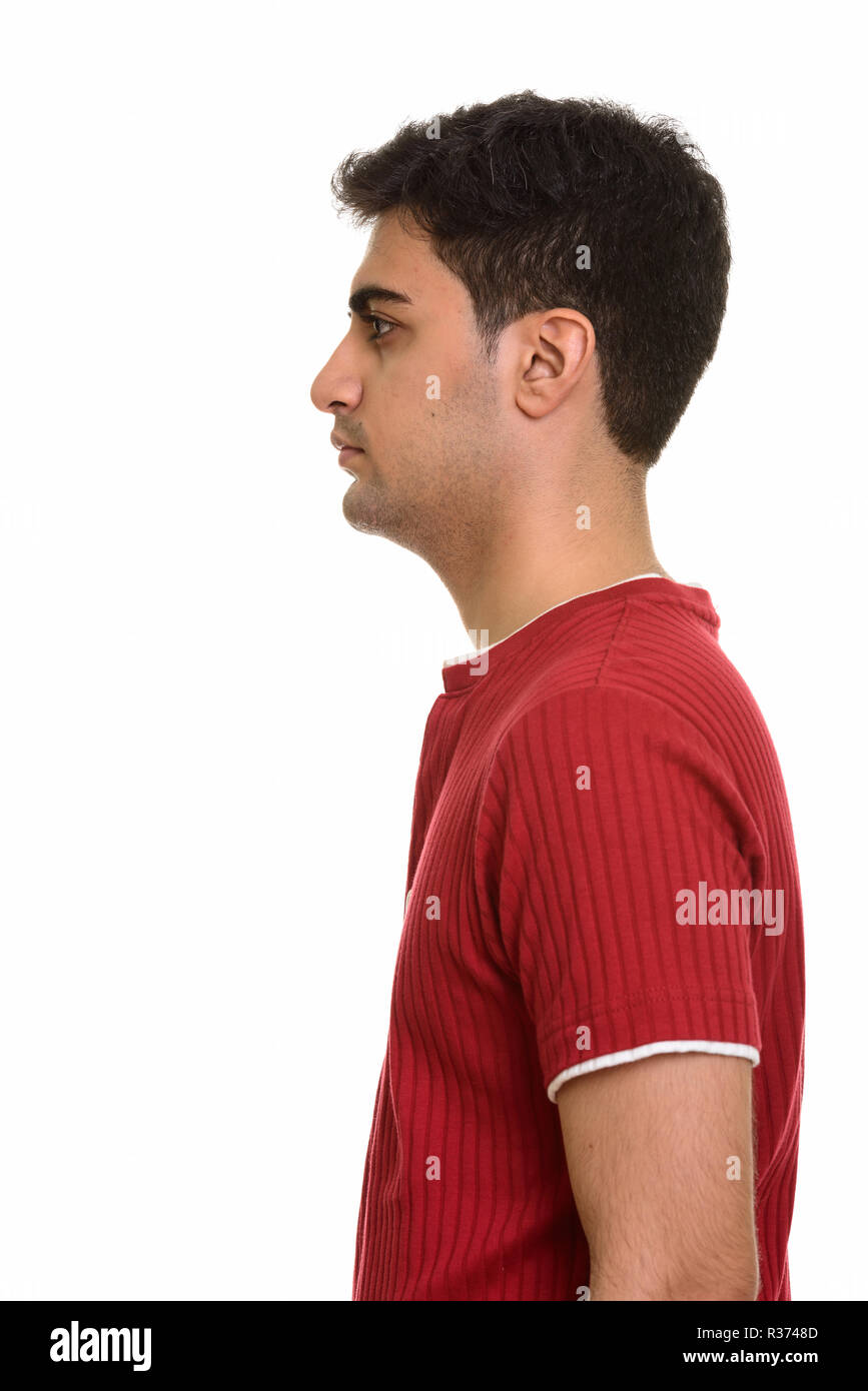 Profile view of young handsome Persian man Stock Photo