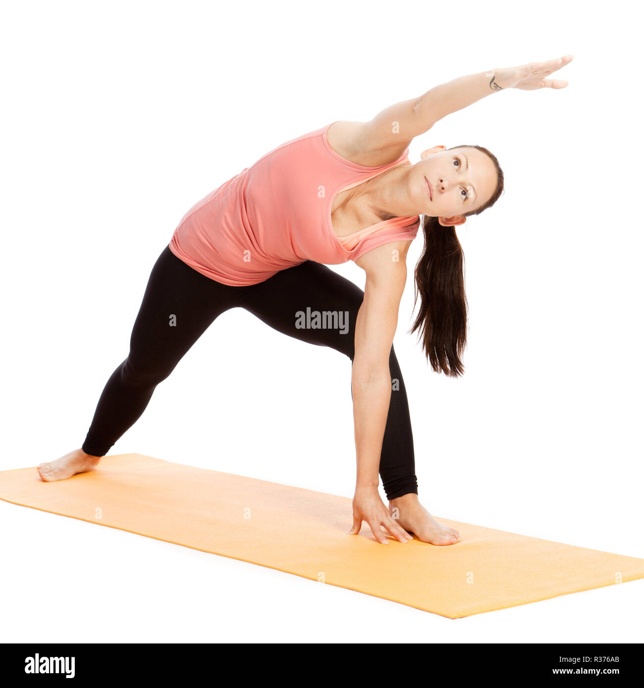 yoga exercise on the mat,utthita parsva konasana Stock Photo