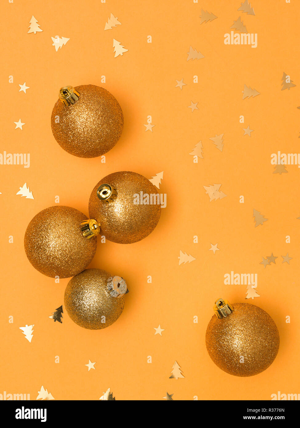 wonderful, gold christmas baubles on gold background Stock Photo - Alamy