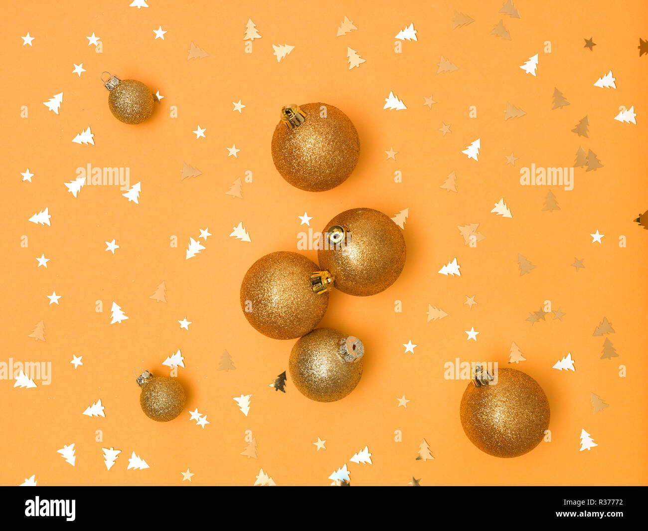 wonderful, gold christmas baubles on gold background Stock Photo - Alamy