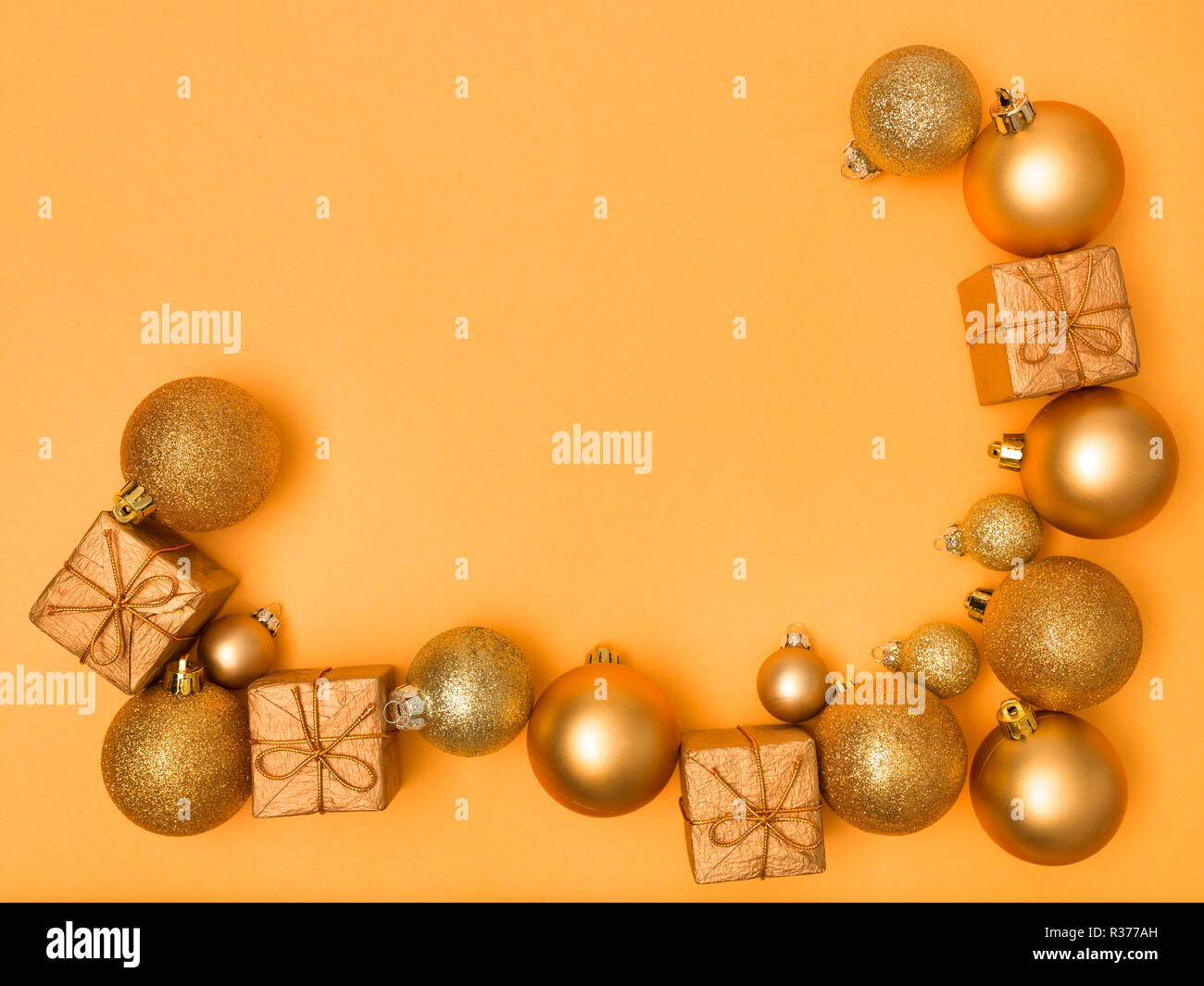 wonderful, gold christmas baubles on gold background Stock Photo - Alamy