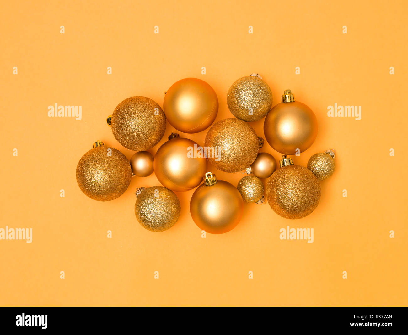 wonderful, gold christmas baubles on gold background Stock Photo - Alamy