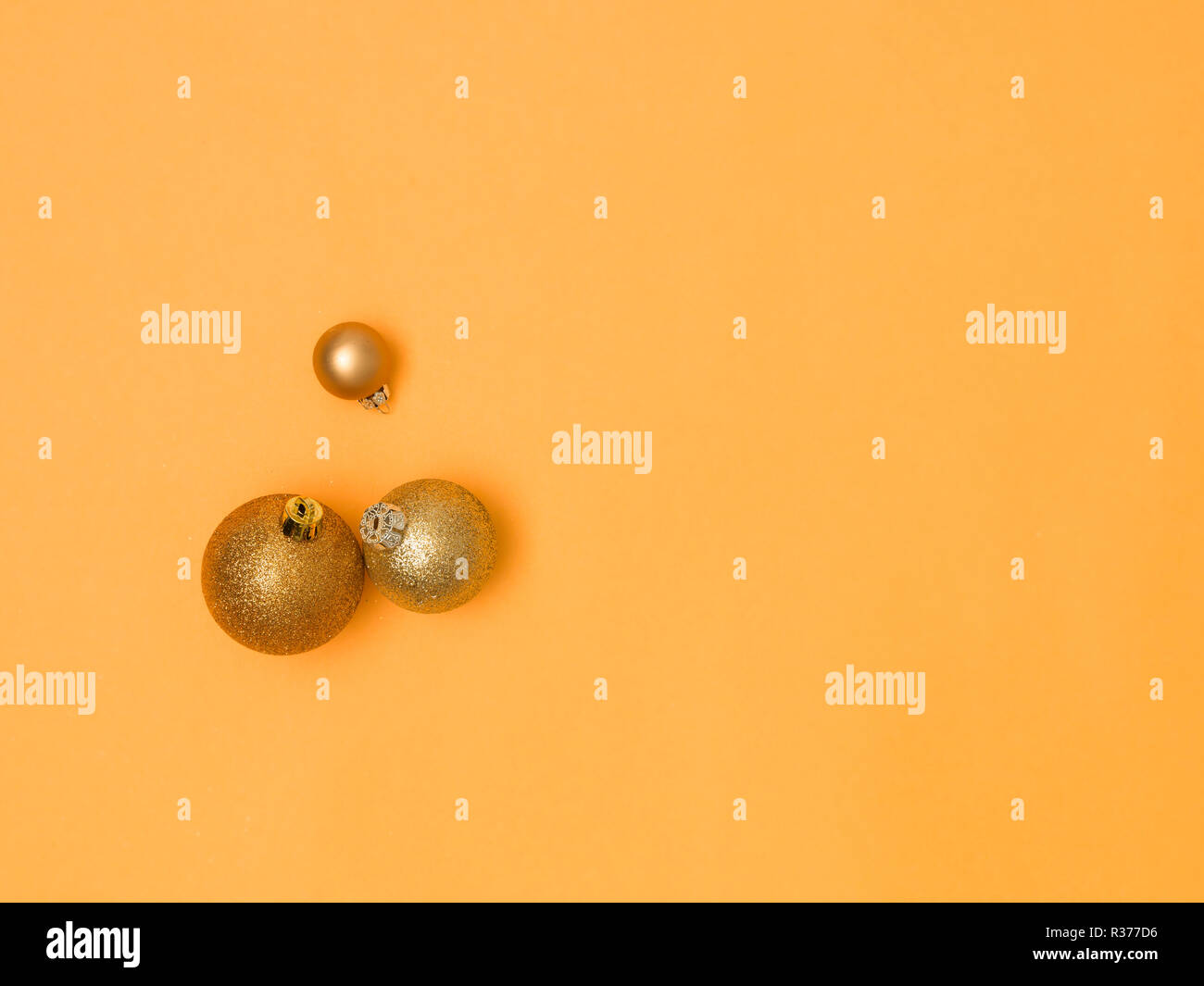 wonderful, gold christmas baubles on gold background Stock Photo - Alamy