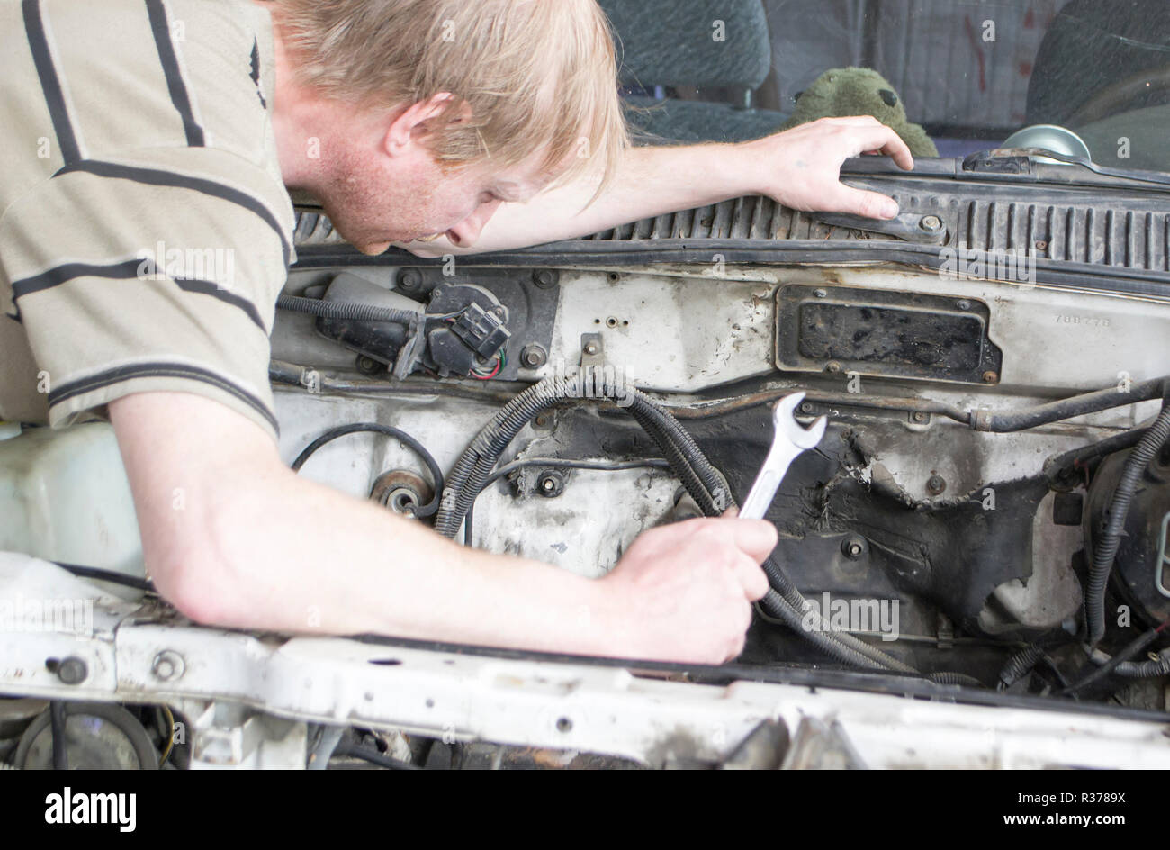 The man is repairing the car Stock Photo